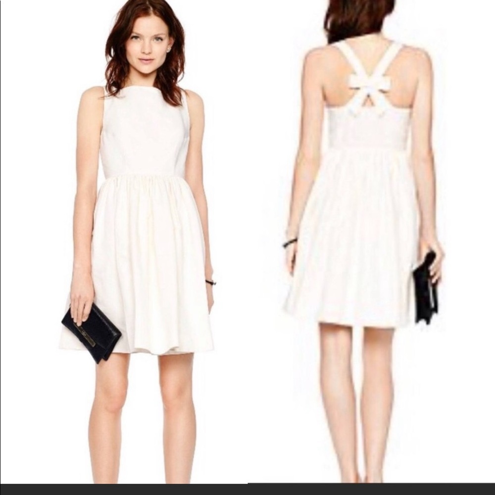 Kate Spade cream dress. It has a bow in the back and side zipper. Size 6.